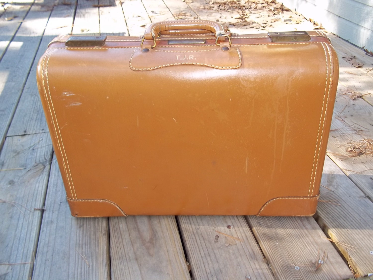 Beautiful toffee colored vintage leather suitcase