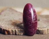 wine.  an oval marbled burgundy vintage cab ring.