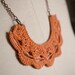 Orange Lace Crochet Bib Necklace with Brass and Antiqued Brass Bar Chain