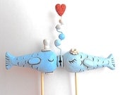 Light Blue Kissing Fish wedding cake topper for your beach wedding as seen in Real Maine Weddings magazine