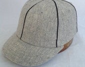 Baseball cap, 6 panel light grey soft wool flannel, black soutache trim with supple leather sweatband.
