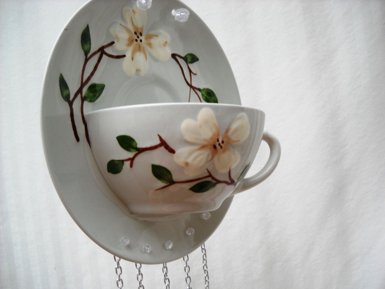 Glass Wind Chimes adorning an upcycled Tea Cup and Saucer with Magnolia Flower