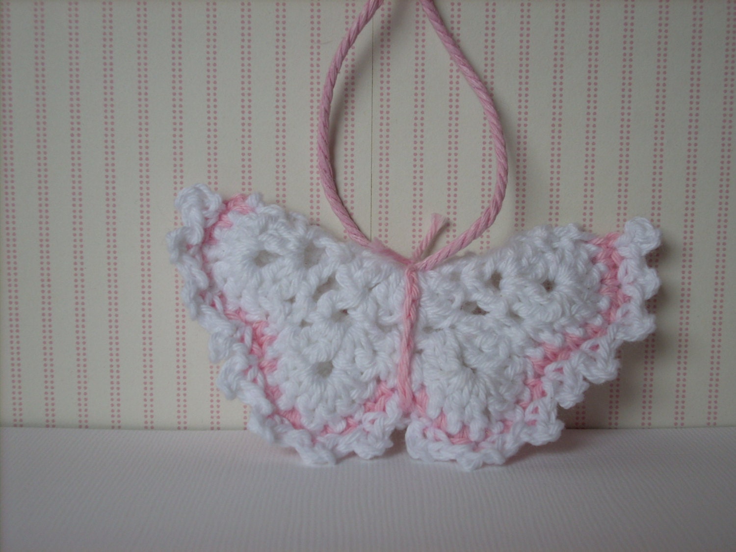 Crocheted butterfly baby girl ornament white and softpink