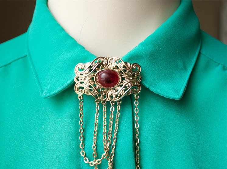 Dame Brooch