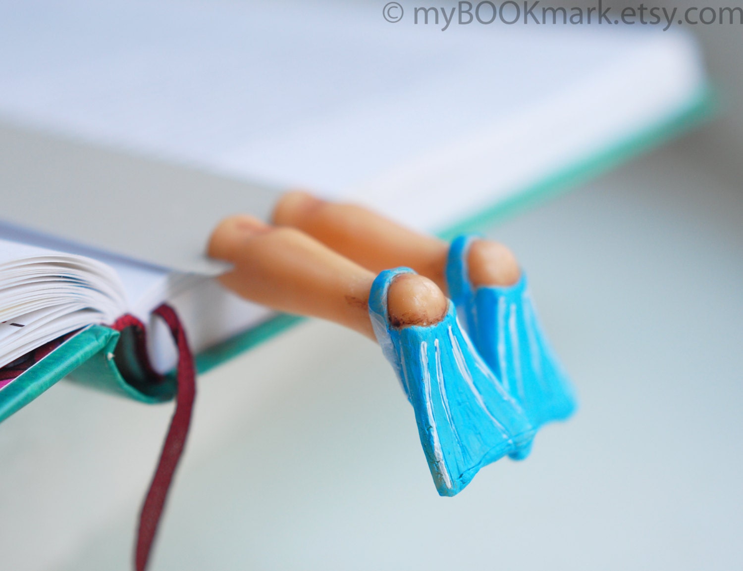 Flippers bookmark. Legs in blue summer flippers. Aqua blue for him. Nautical for vacation by the sea . Beach reading