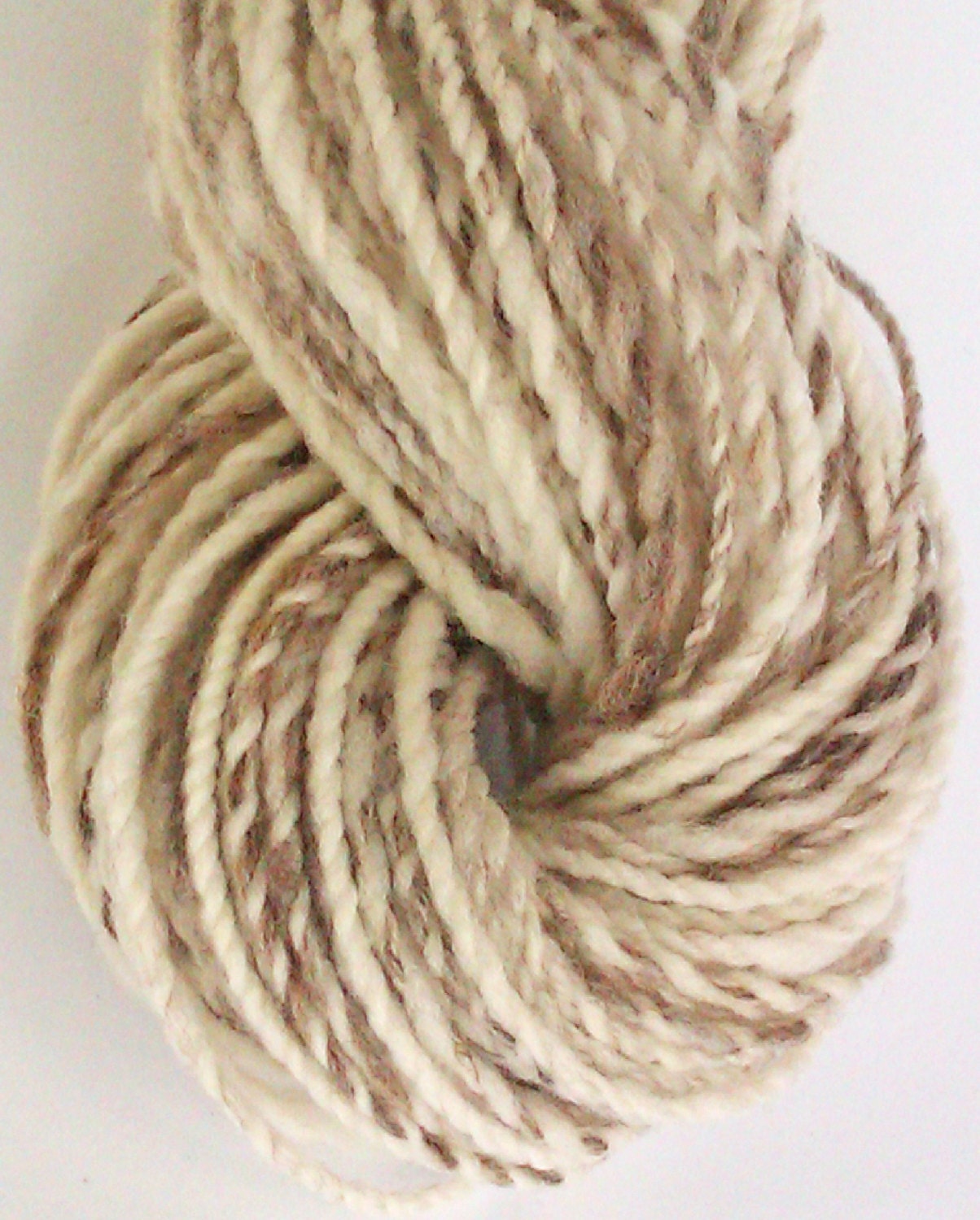 Natural beauty - Natural hand spun. Spotted merino  Hand processed  wool yarn 2 ply super soft. Stunning colour variations.  .