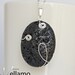 Beautiful black volcano lava pendant with sterling silver wire shapes, 45mm