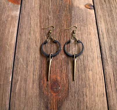 Black retaining ring earrings with antique gold needles
