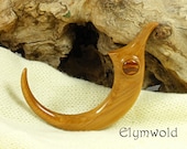 A small hair claw, or hair stick.  Handmade by Elymwold.