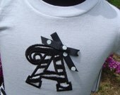Appliqued alphabet tee shirt with bow