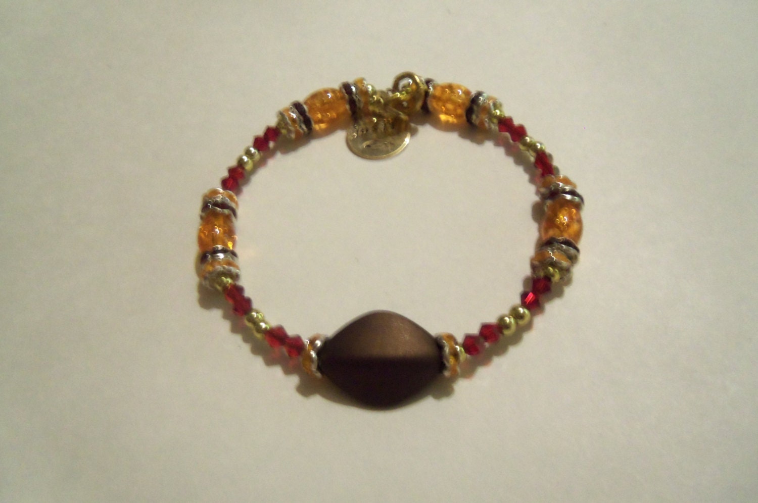 Satiny brown ruby red and orange dainty bracelet