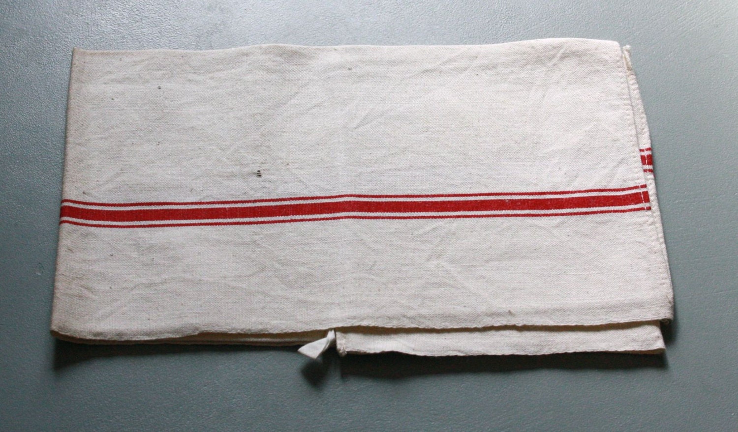 red striped towel, unused and unwashed, vibrant red
