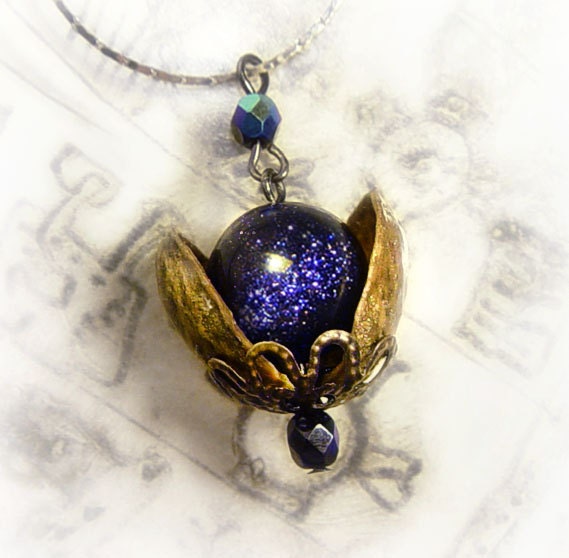 Universe in a nutshell pendant made with real pistachio shells and blue sandstone