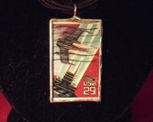 Double-sided glass charm with Science Fiction Stamps