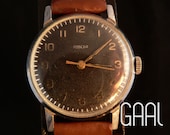 Aged Pobeda watch with nice black dial