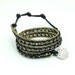 Hematite with gold plated chain wrapped cotton bracelet.