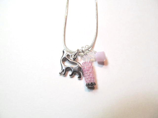 Charm necklace wolf with beaded bead and pink crystals