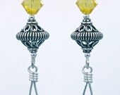 Sterling silver earrings with denim blue briolettes and pale yellow crystals.