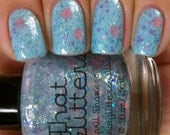 April Showers - pale shimmer base with pastel blues, greens, pinks (flowers), purples and iridescent glitter nail polish