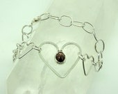 Sterling silver and garnet heart link bracelet