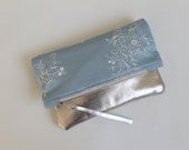 Fold over clutch, blue embroidered fabric and leather