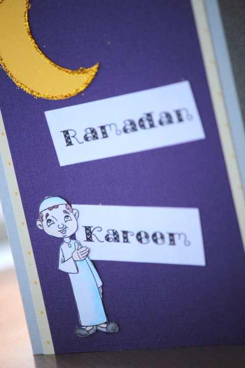 Ramadan Kareem,Card with a glitter yellow Crescent and a muslim kid with Jilbab, for the Islamic Holiday