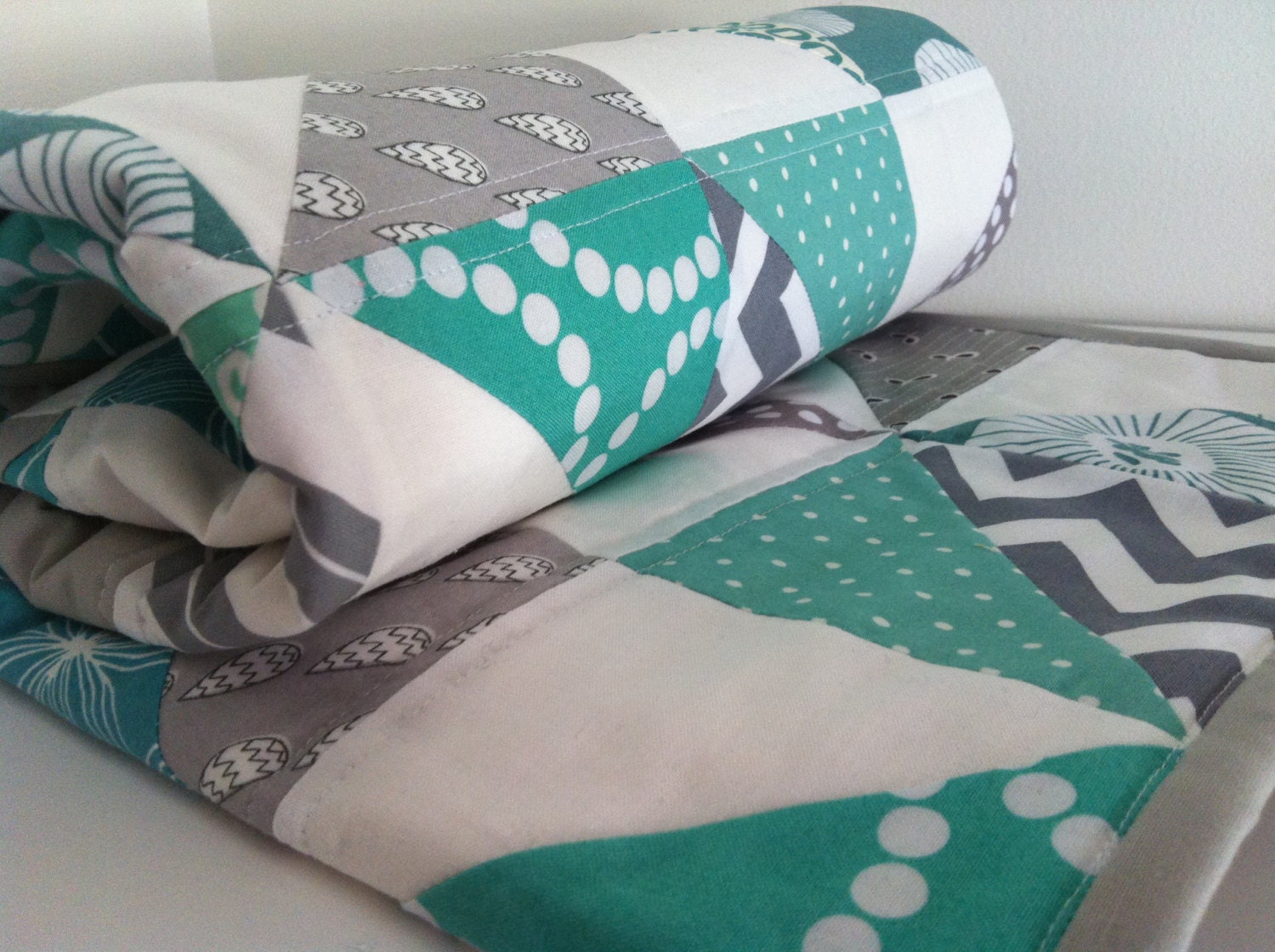 Mint Green and Grey Geometric Handmade Modern Cot Crib Patchwork Quilt in triangles for Baby Child Nursery.