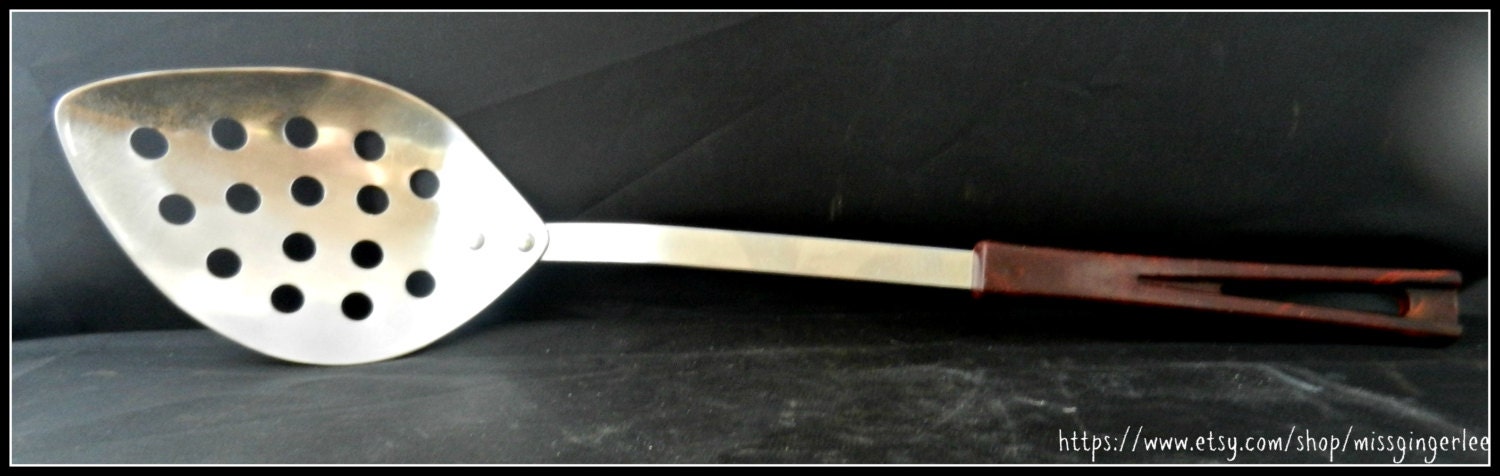 Vintage 1970's Stanhome Stanley Roberts stainless steel kitchen tool slotted serving spoon with brown Bakelite handle