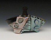 Modern graphic pattern basket with handle and feet black white and greens