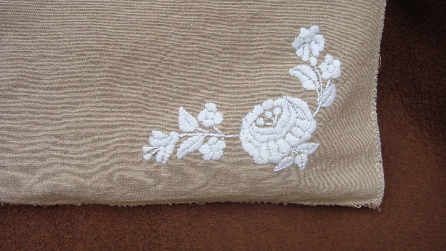 Beige linen cotton pillow case with hand embroidered folk motif in white