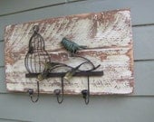 Reclaimed wood with metal bird and bird house with hooks