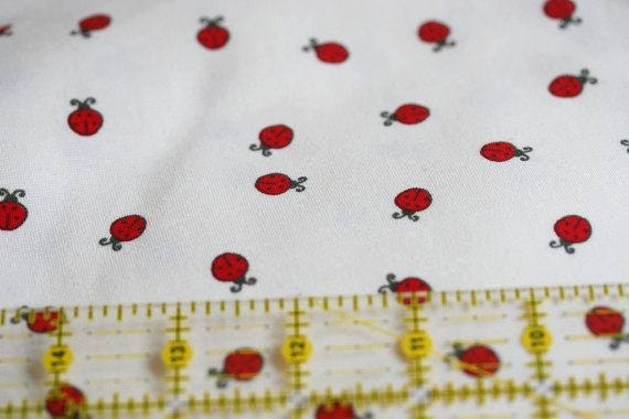 1.15 Metres Organic Cotton Jersey Fabric in ladybirds