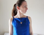 Structured, geometrical cut-out top made from pure silk in electric blue colour