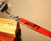 Shaving razor handle in red camouflage