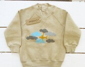Yellow airpland in clouds handprinted on organic cotton baby sweater