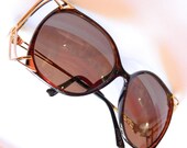 Alluring Dior Vintage oversized sunglasses with gold-flecked black frames and gold cage details