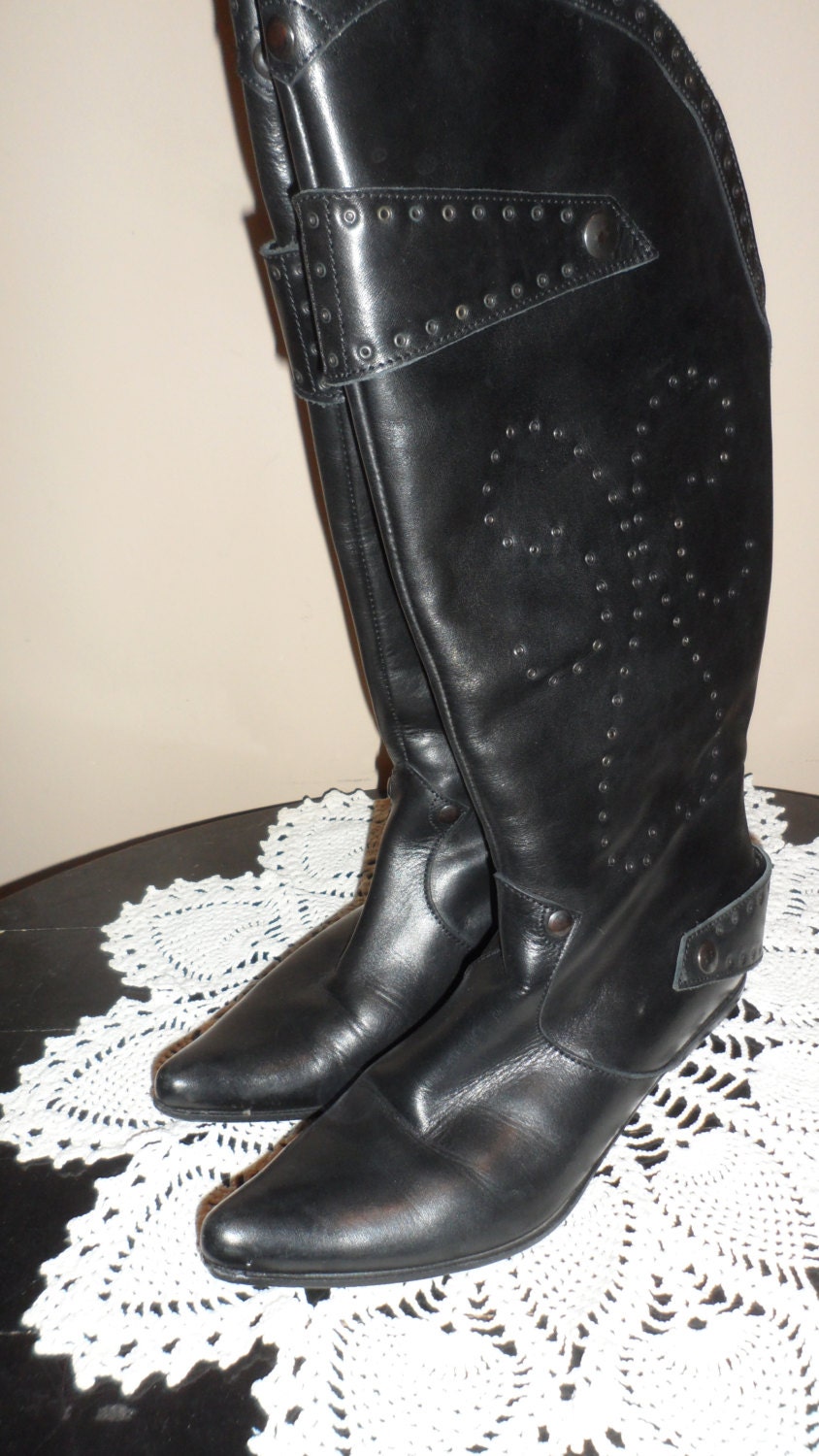 vintage black leather boots with clover  or flower like like design these were 400 new with strapsmetal circle rivets size 37   6 1/2 to 7