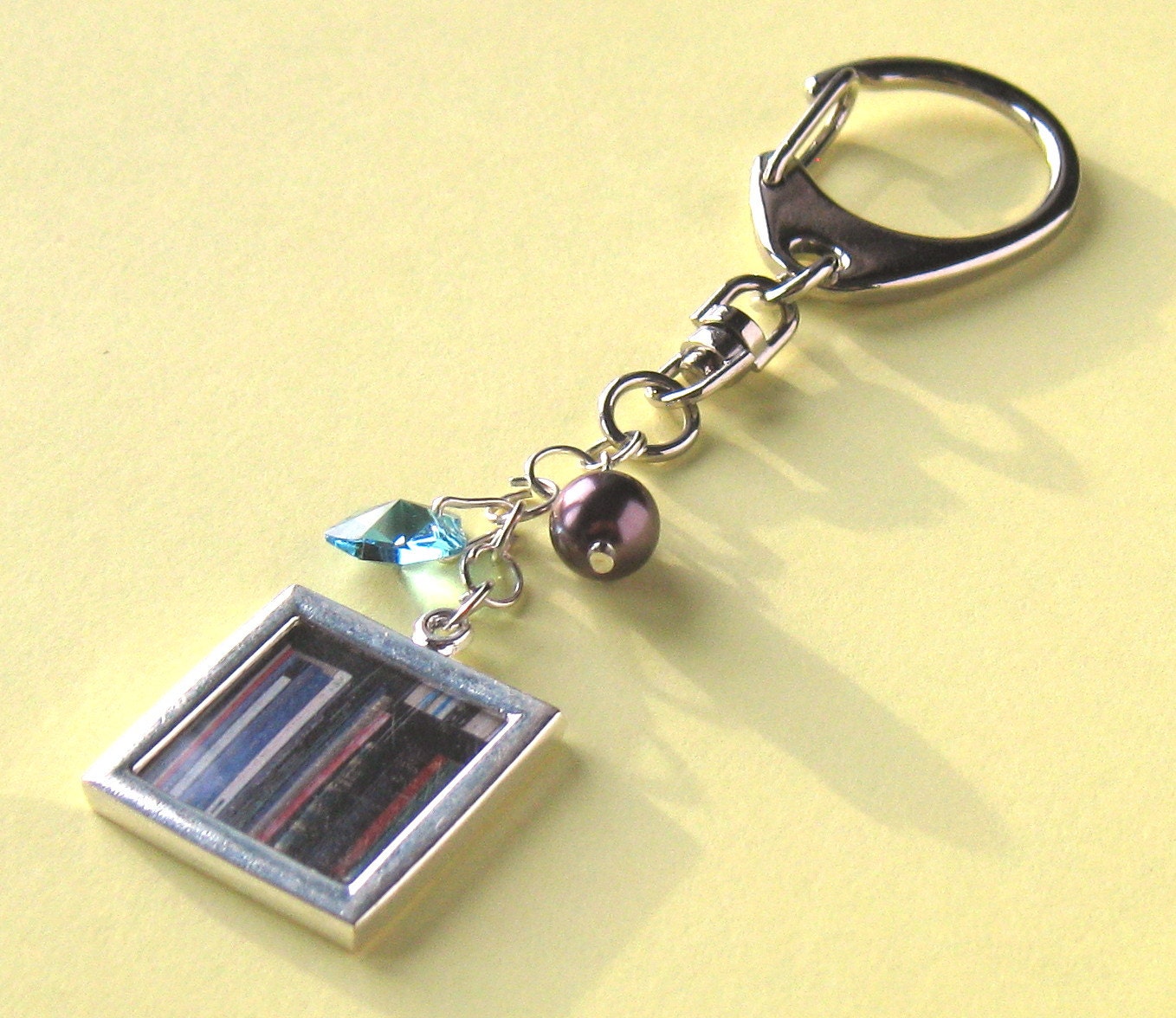Bag charm, keychain with picture of Vintage books on shelf with Swarovski Heart & pearl - recycled, upcycled.
