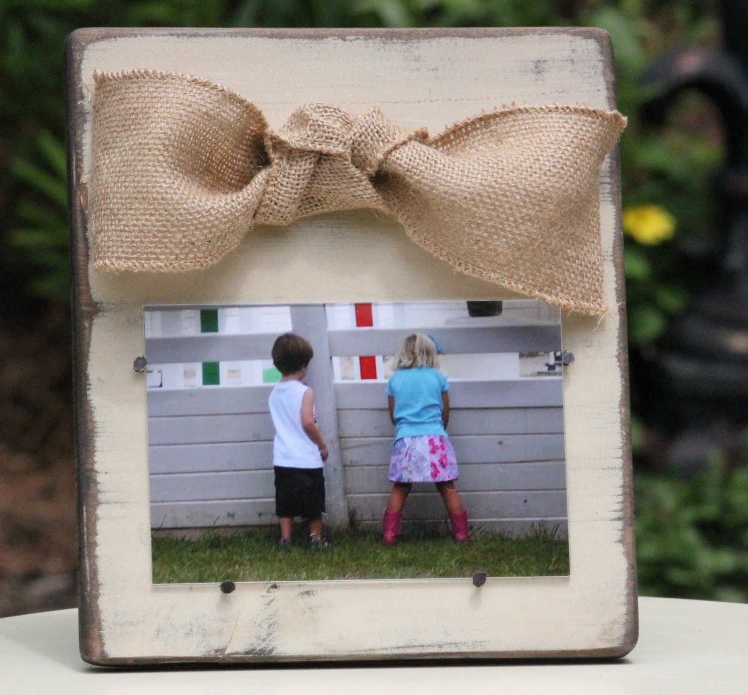 Cream Distressed Wooden Frame with a Natural Burlap Bow