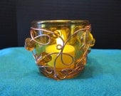 Yellow glass scroll tea light holder