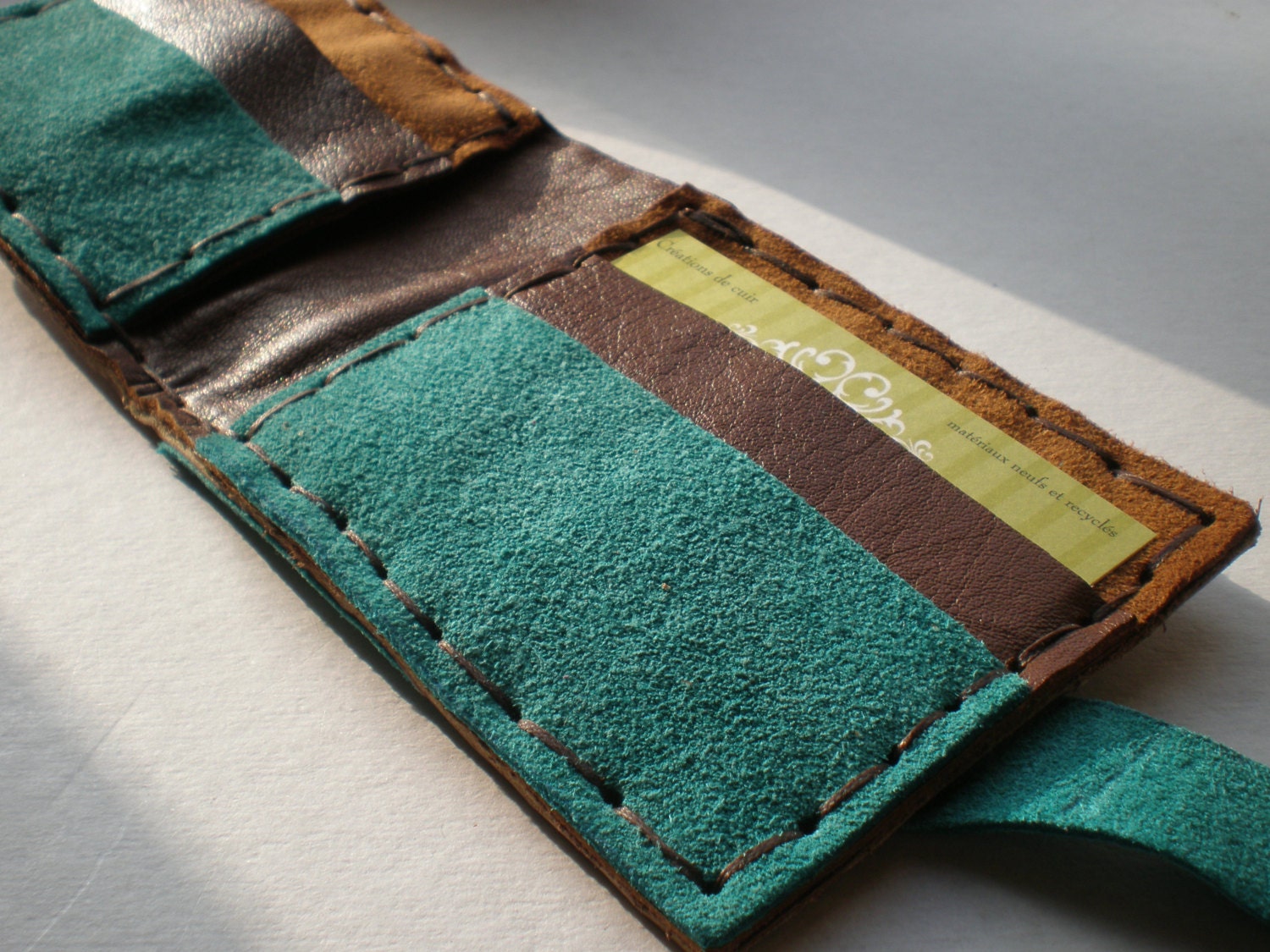 handmade leather wallet in brown and turquoise