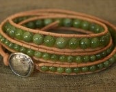 Jade, Sterling Silver, triple wrap leather beaded bracelet.  Semiprecious Green Jade beads, sterling button.