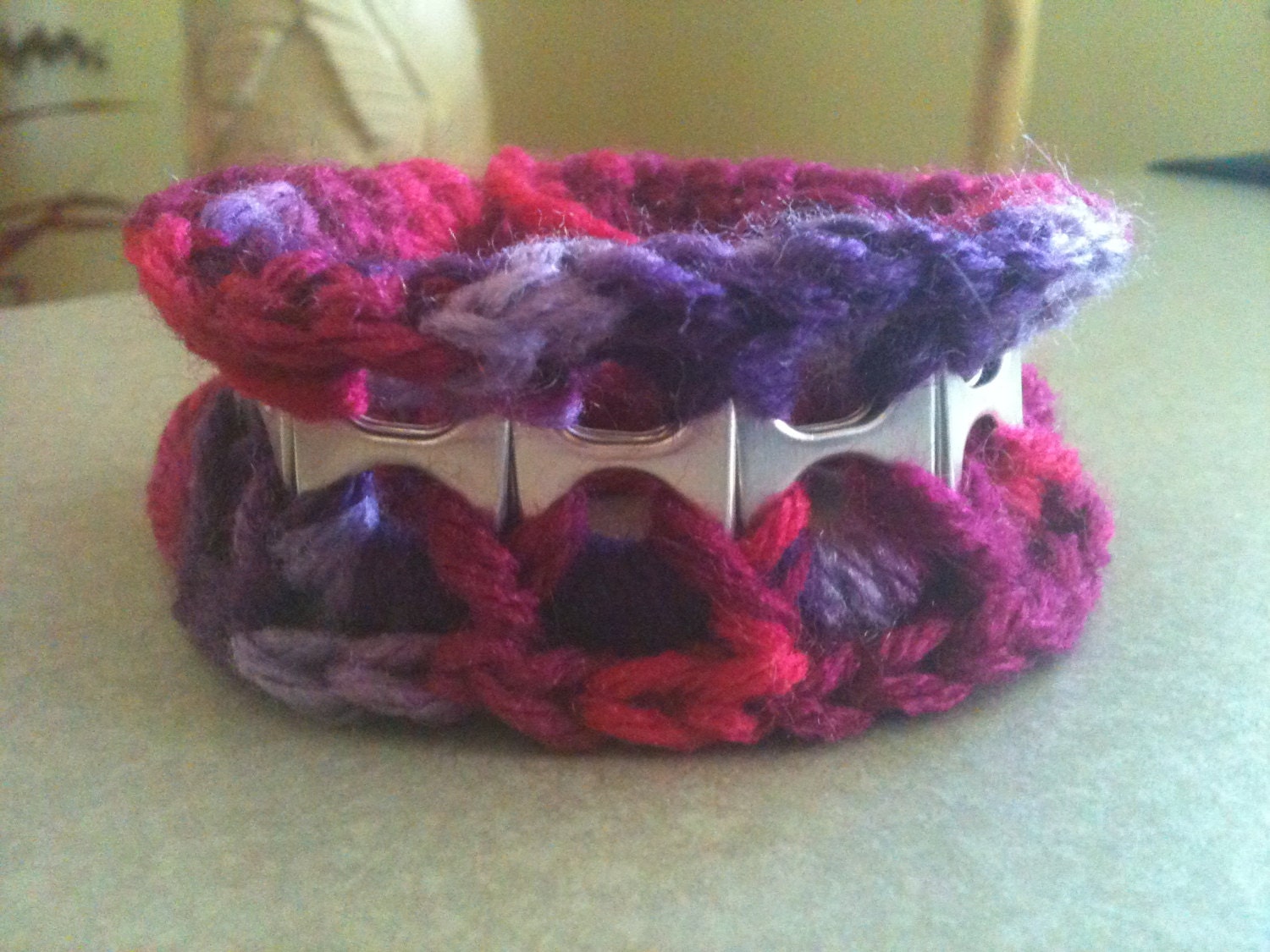 Upcycled crochet bracelet made with soda can tabs.