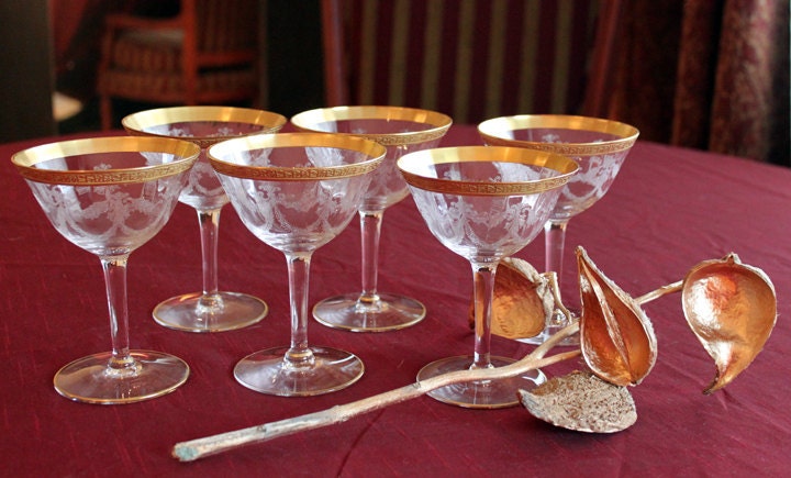 Set of 6 crystal wine glasses, beautifully etched,  with gold leaf rim. 6" tall