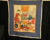 Toy baby quilt framed in blue - hand quilted