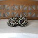 Small Ruffle Rose Pillow in Eclectic Stripe. Eco friendly recycled materials.
