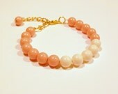 Light coral and ivory cream Swarovski pearl color block adjustable bracelet with gold chain