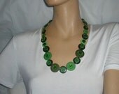 Long green button necklace for St. Patrick's Day.