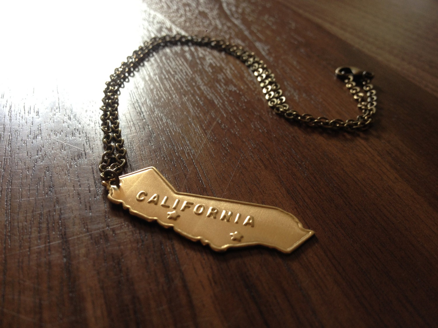 one at a time // California / solid brass