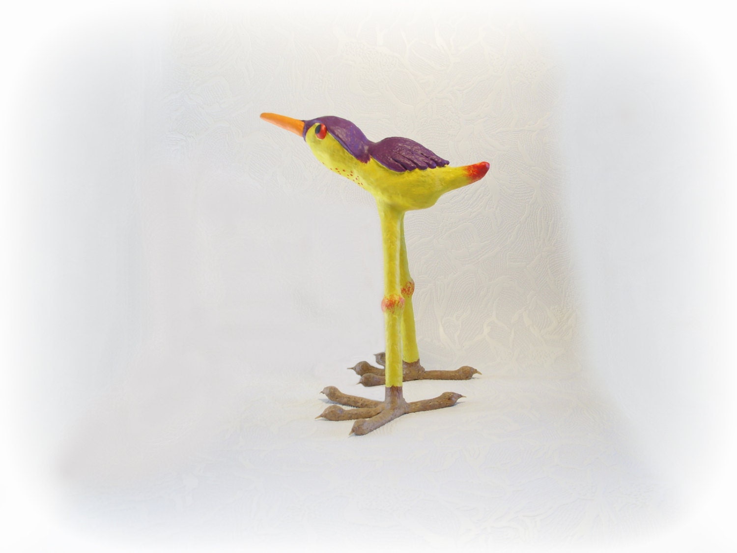 Bird of a different color paper mache